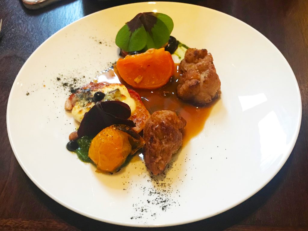 Crispy veal sweetbread, multicoloured heritage tomatoes, pine nuts and thyme jus