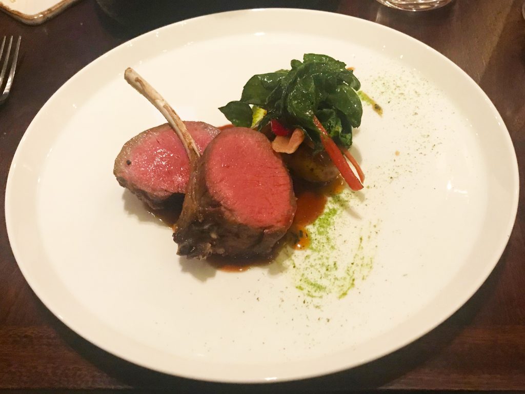 Roast rack of Herdwick lamb, multicoloured chard, glazed Rattes potatoes and jus